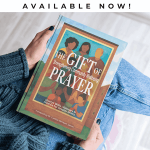 The Gift of Prayer in someone's lap with the words Available Now at the top of the image