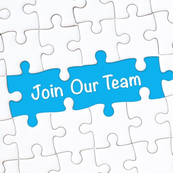 Puzzle with pieces spelling "Join Our Team"
